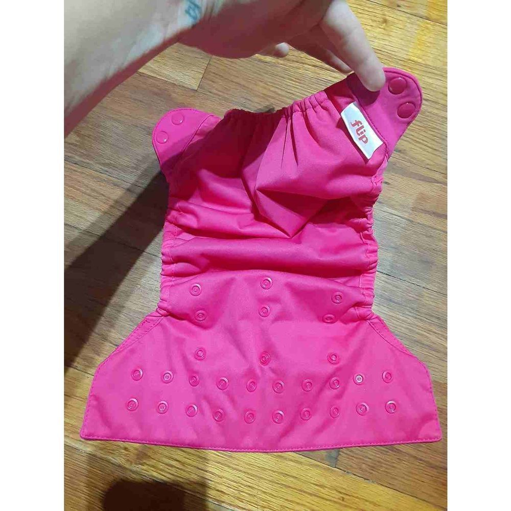Cloth diapers cover by FLIP in pink.